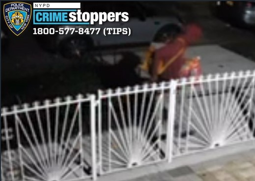 Low-quality surveillance image of a person wanted for arson.