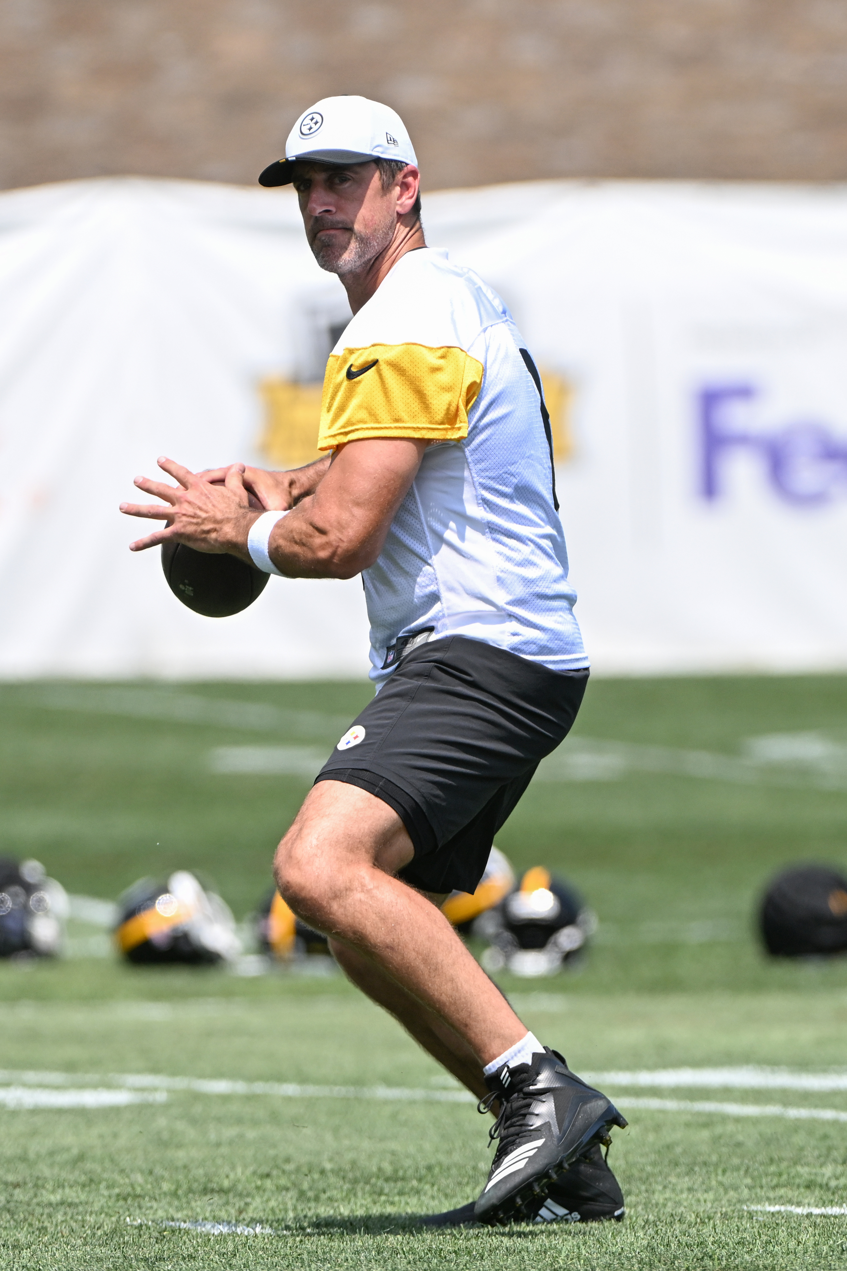 Aaron Rodgers on the football field at training camp. 