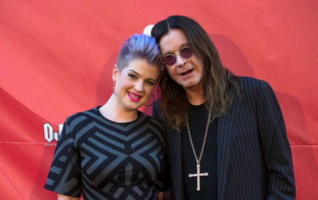 Musician Ozzy Osbourne (R) and his daughter Kelly Osbourne pose at the 10th Annual MusiCares MAP Fund Benefit concert at Club Nokia in Los Angeles, California May 12, 2014. REUTERS/Mario Anzuoni/File Photo