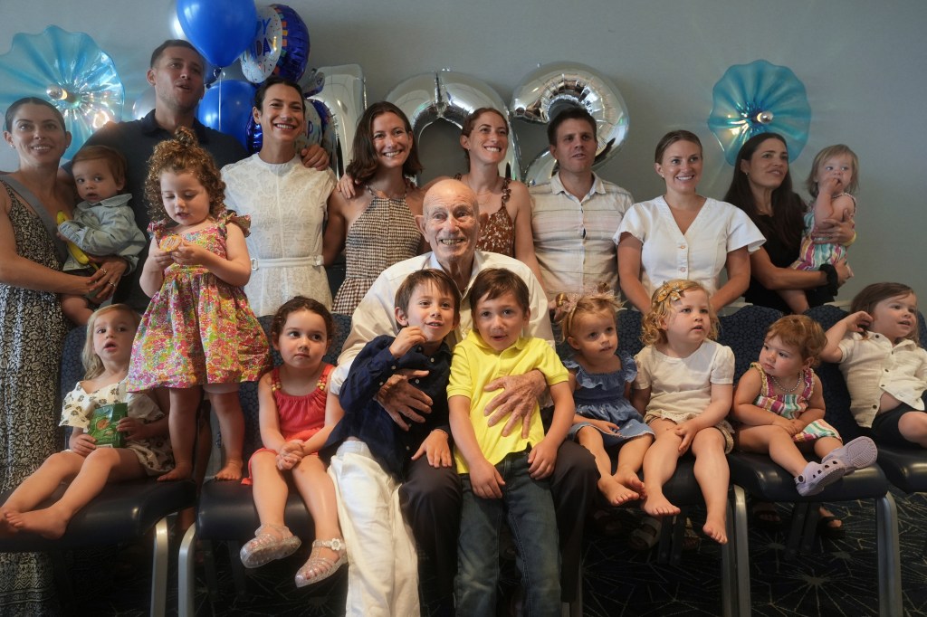 A World War II veteran celebrating his 102nd birthday with his family.