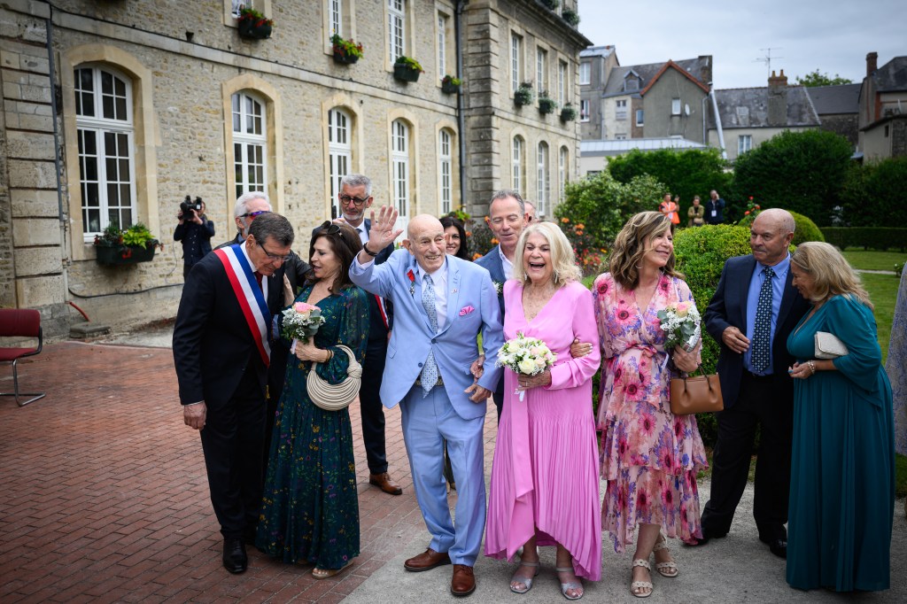 A 100-year-old WWII veteran and his 96-year-old bride at their wedding ceremony in Normandy, France.