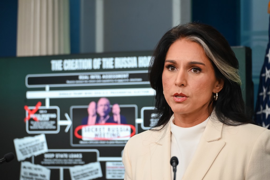 Tulsi Gabbard speaking at a press conference.