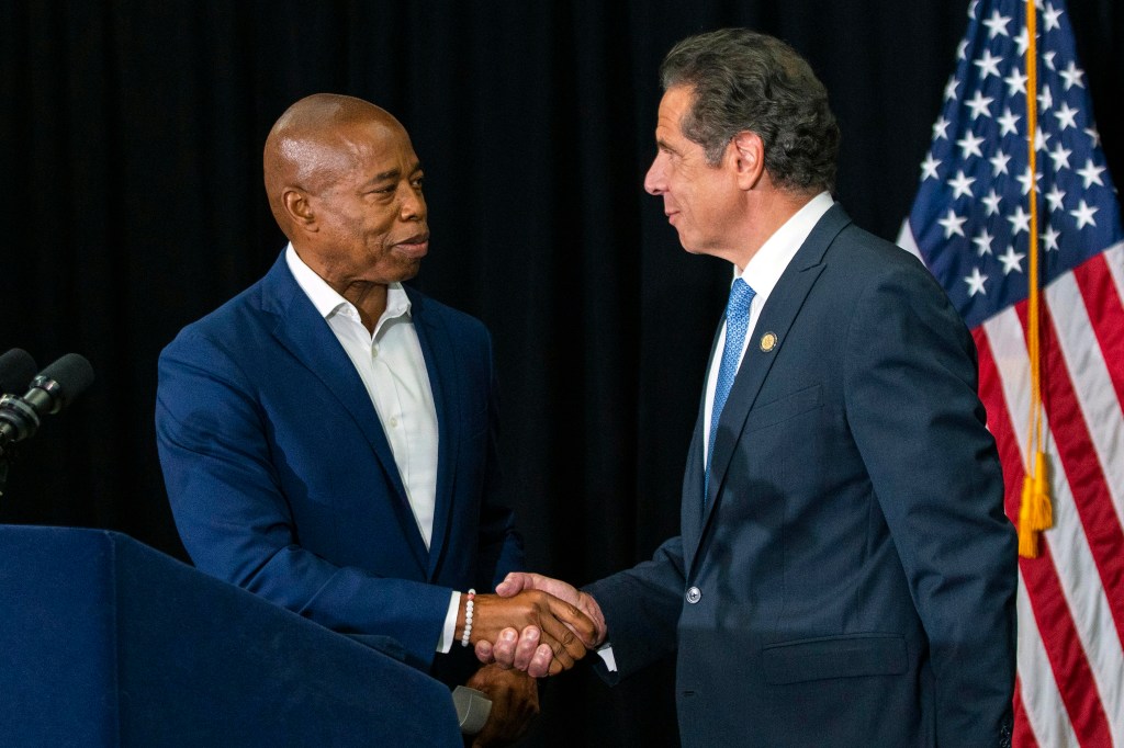 Then NYC mayoral candidate Eric Adams shakes hands with then Gov. Andrew Cuomo during a press conference in Brooklyn, NY on July 14, 2021.