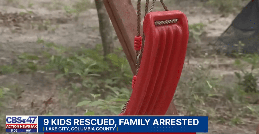 A broken swing on the property of the mobile home.