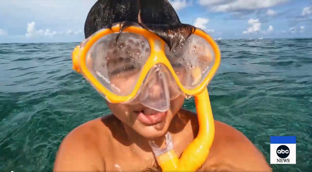 Close-up video of James Reeder Jr snorkeling in the ocean.