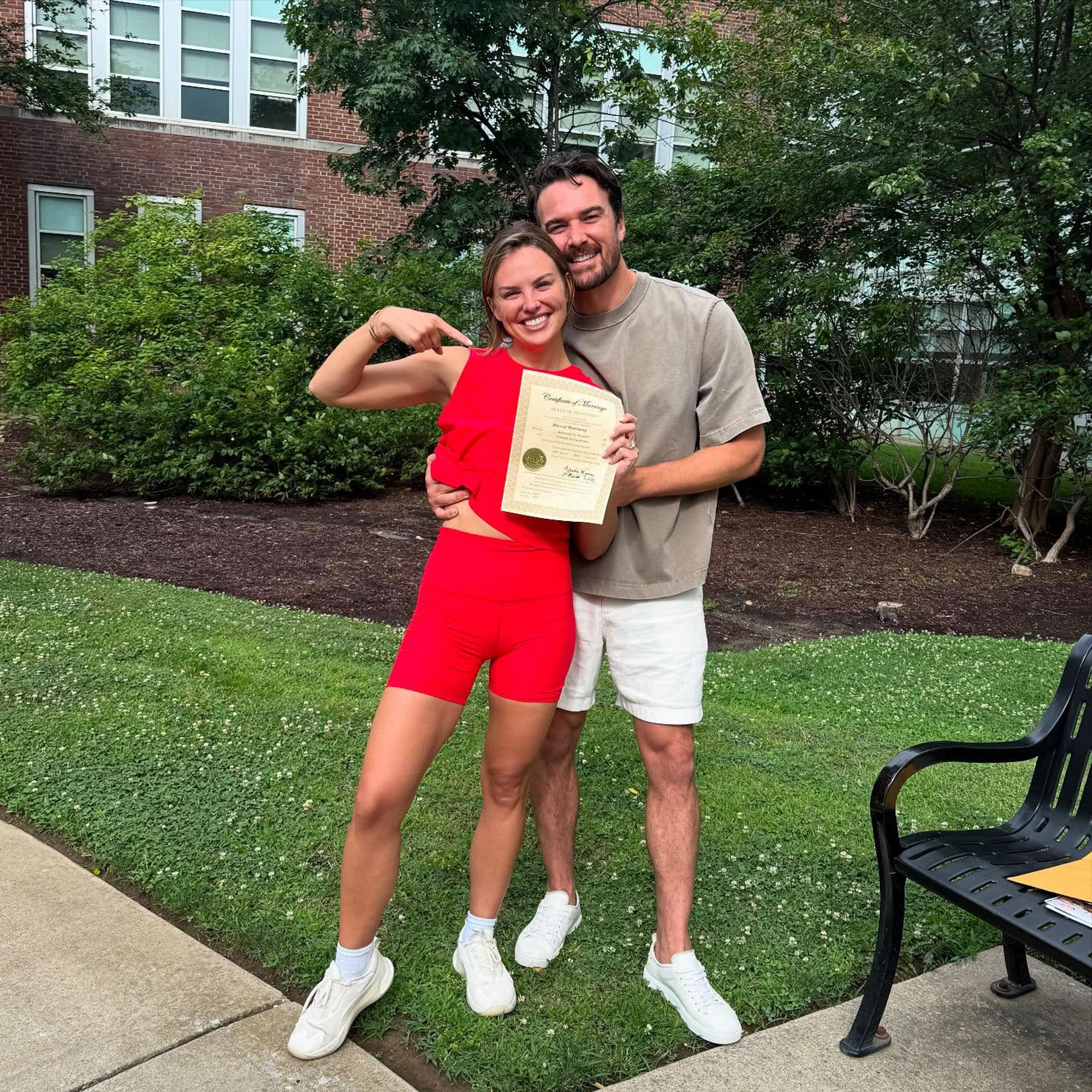 Hannah Brown and Adam Woolard with a wedding license. 