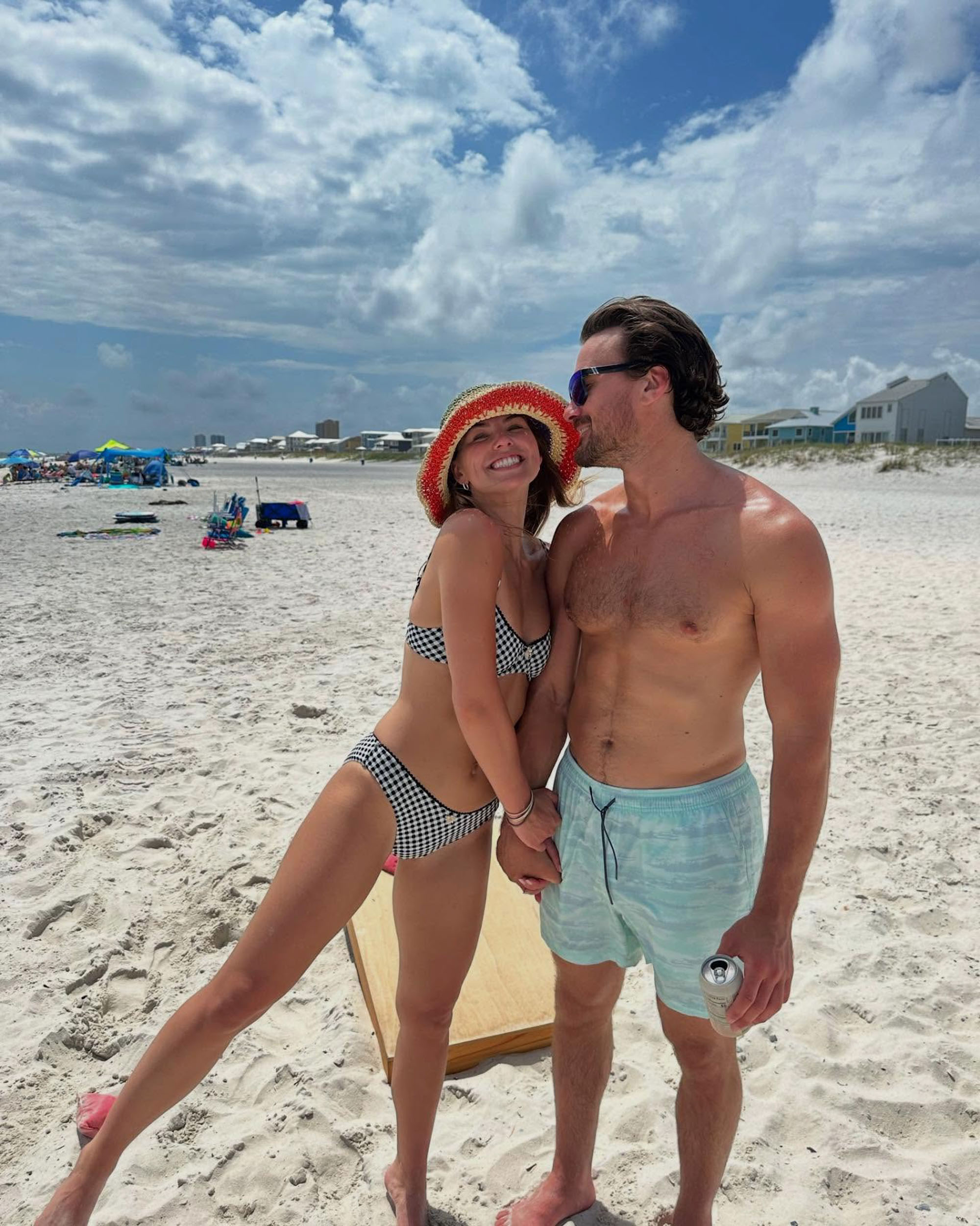 Hannah Brown and Adam Woolard on the beach. 