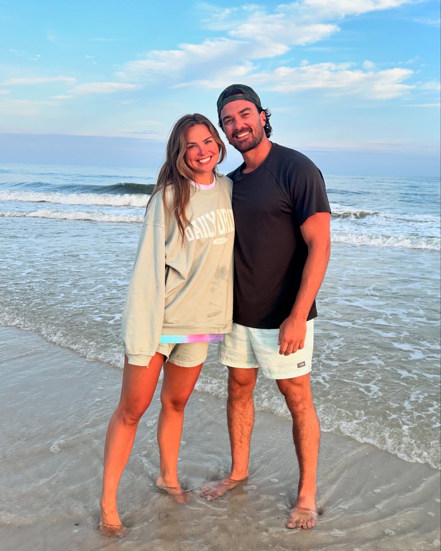 Hannah Brown and Adam Woolard on the beach. 