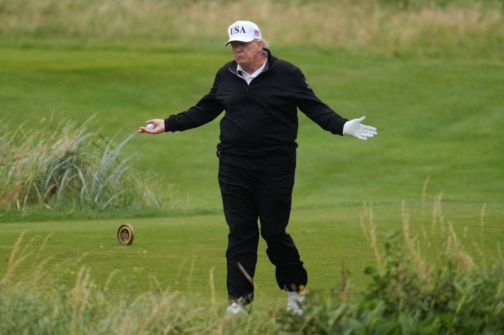 Donald Trump playing golf.