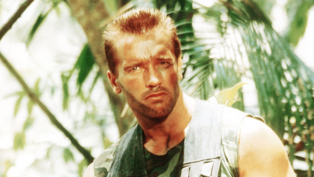 ‘Predator: Badlands’ Director Plans To “Cook Up Stuff” For Arnold Schwarzenegger’s Franchise Return After Meeting — SDCC