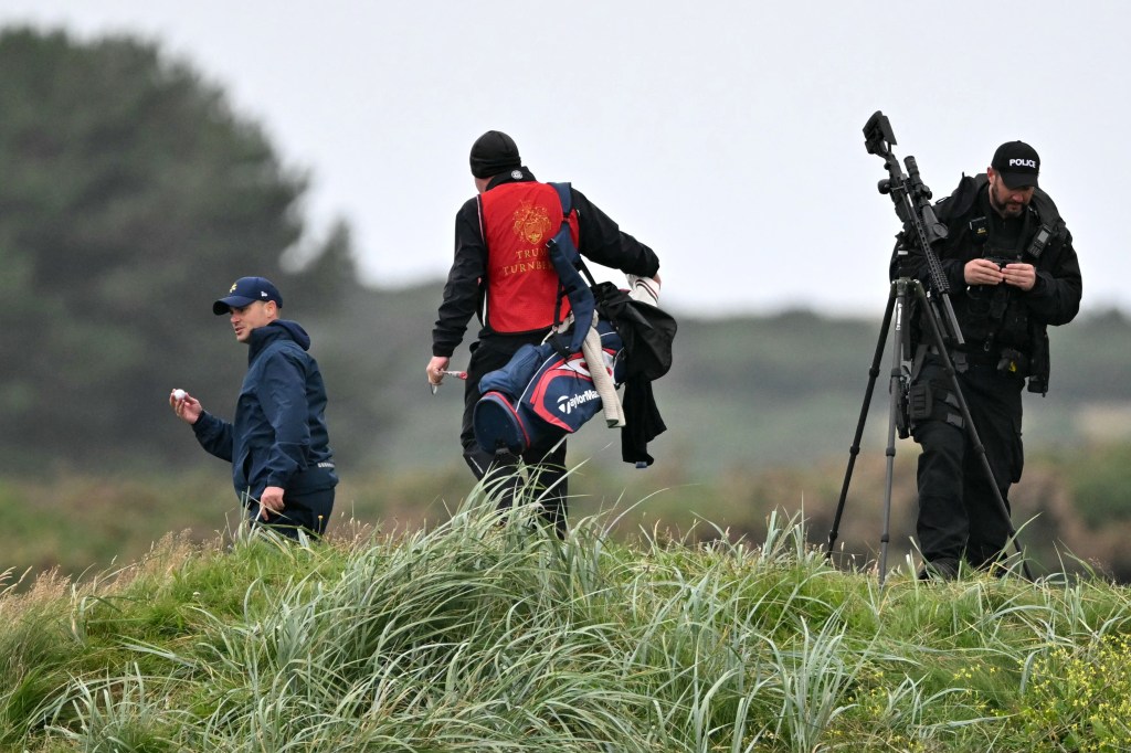 A sniper on the Turnberry course near other golfers.