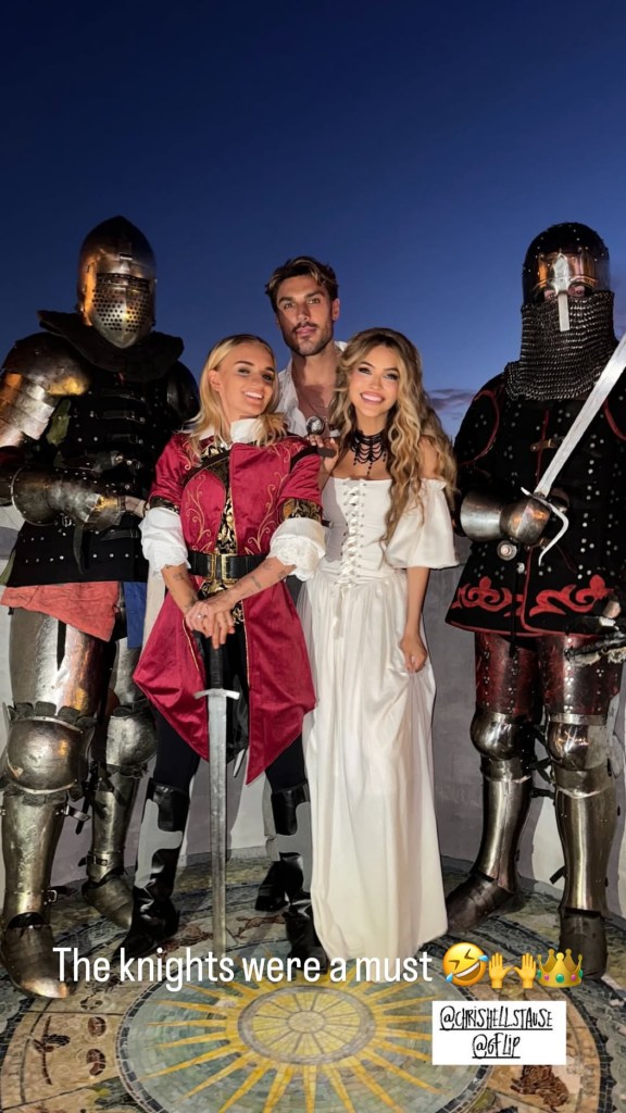 Chrishelle Stause and G Flip getting married in a medieval-themed ceremony and posing with guest Chris Appleton.