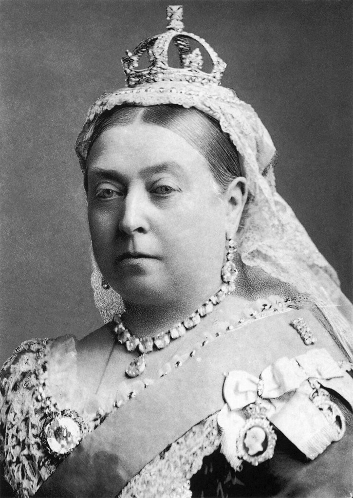 Portrait of Queen Victoria wearing a crown and jewelry.
