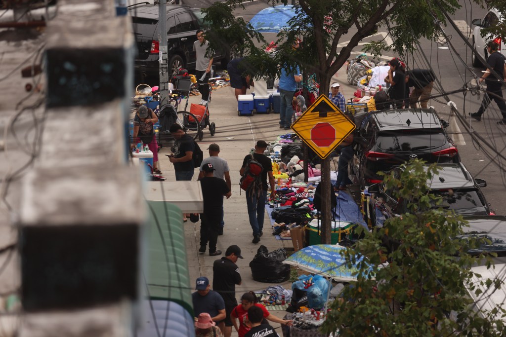Illegal vendors on the sidewalk on 91st St. near Roosevelt Ave. in Queens on July 27, 2025.