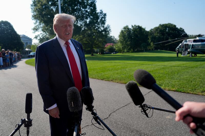 U.S. President Donald Trump speaks to the members of the media before boarding Marine One to depart for Scotland, on the South Lawn at the White House in Washington, D.C., U.S., July 25, 2025. REUTERS/Kent Nishimura