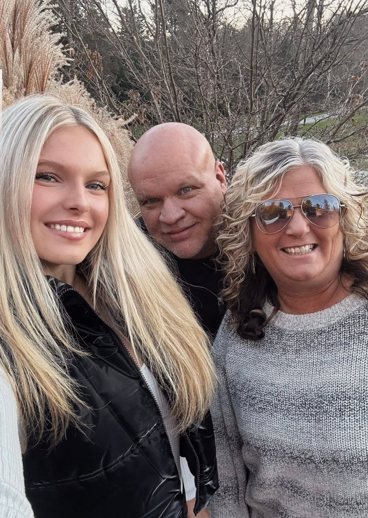 Photo of a young woman with her parents.