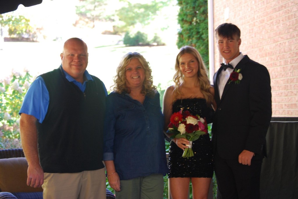 Family portrait at an outdoor event.