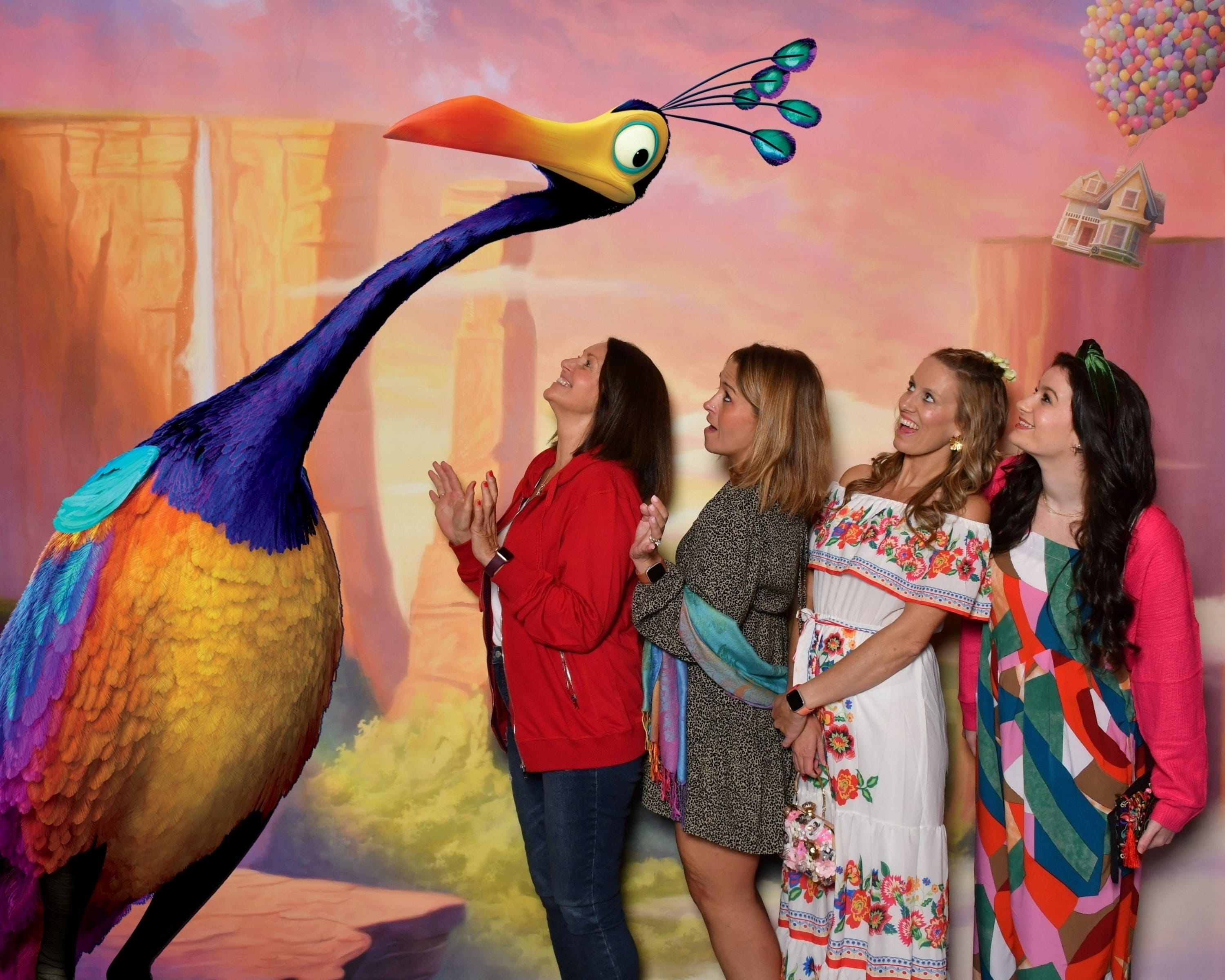 Four friends at a photo opportunity aboard the Disney Treasure cruise ship.