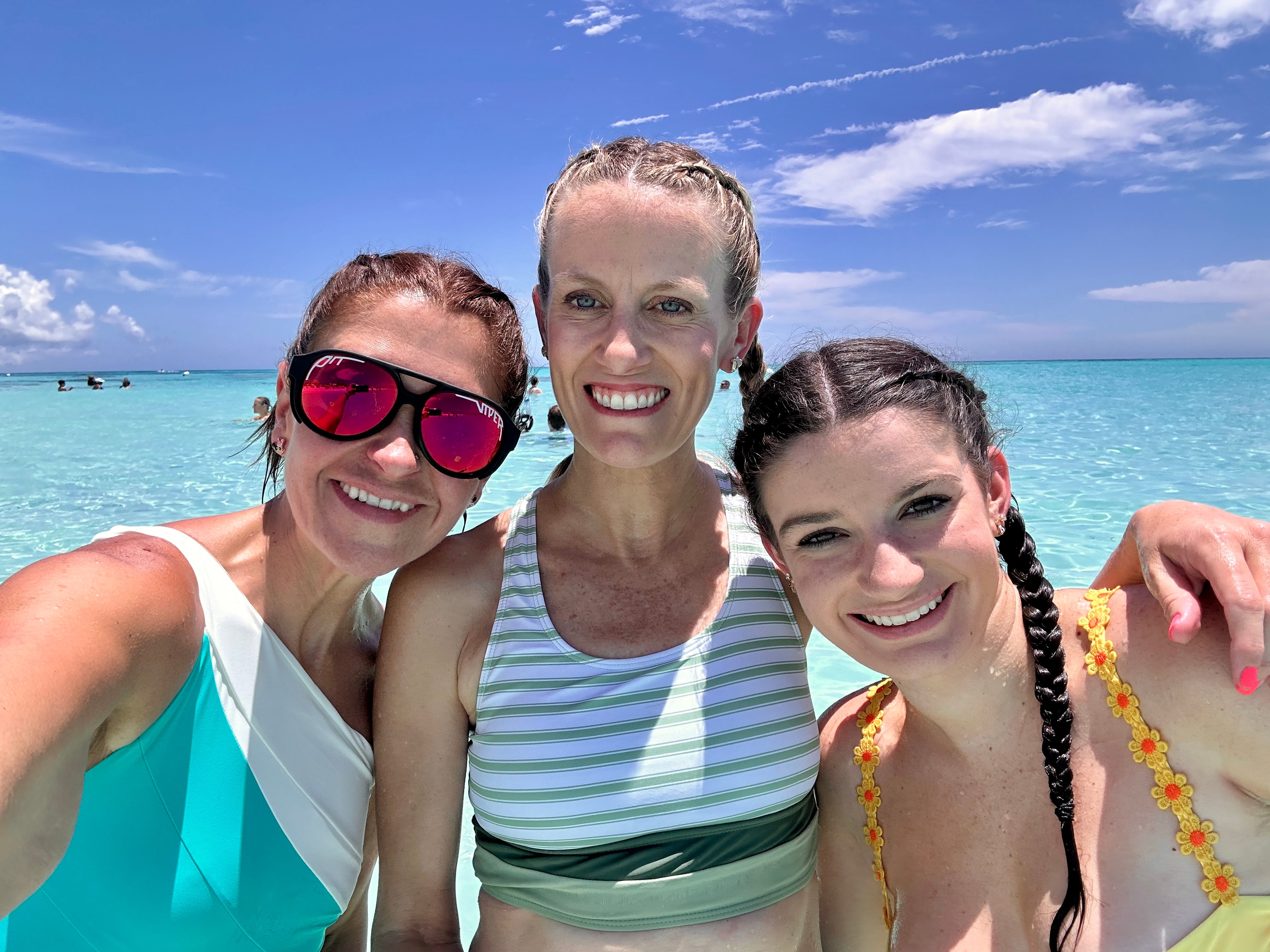 The author and her friends in front of the ocean.