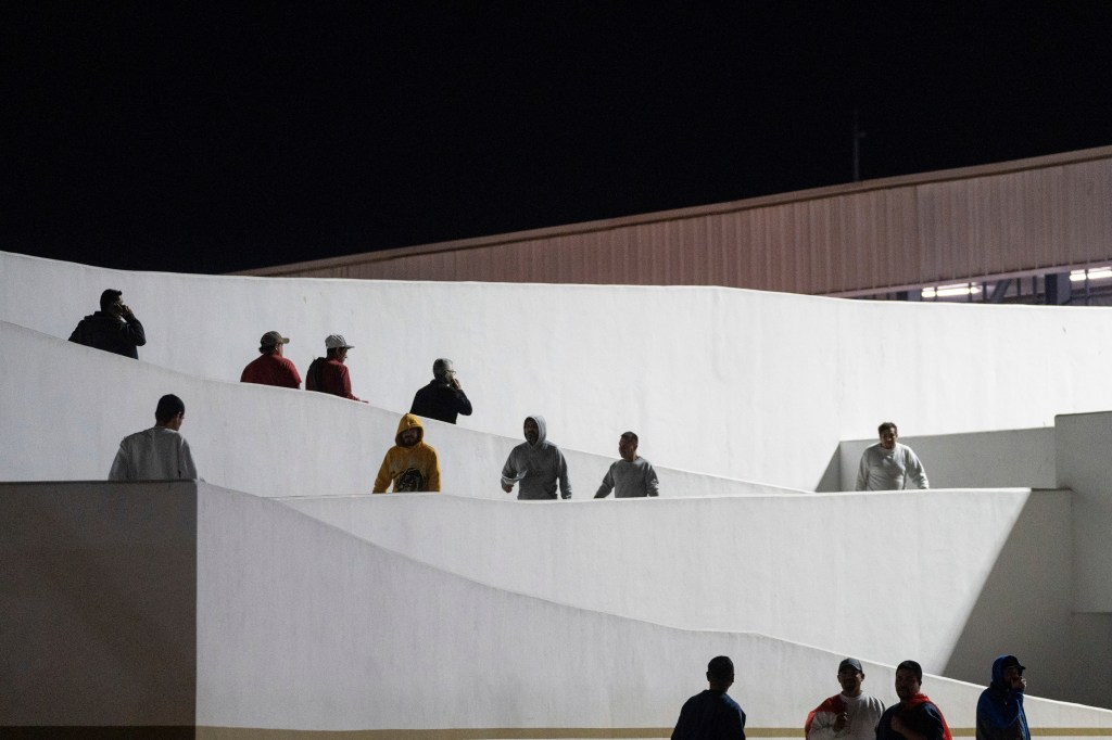 Migrants walking at night.