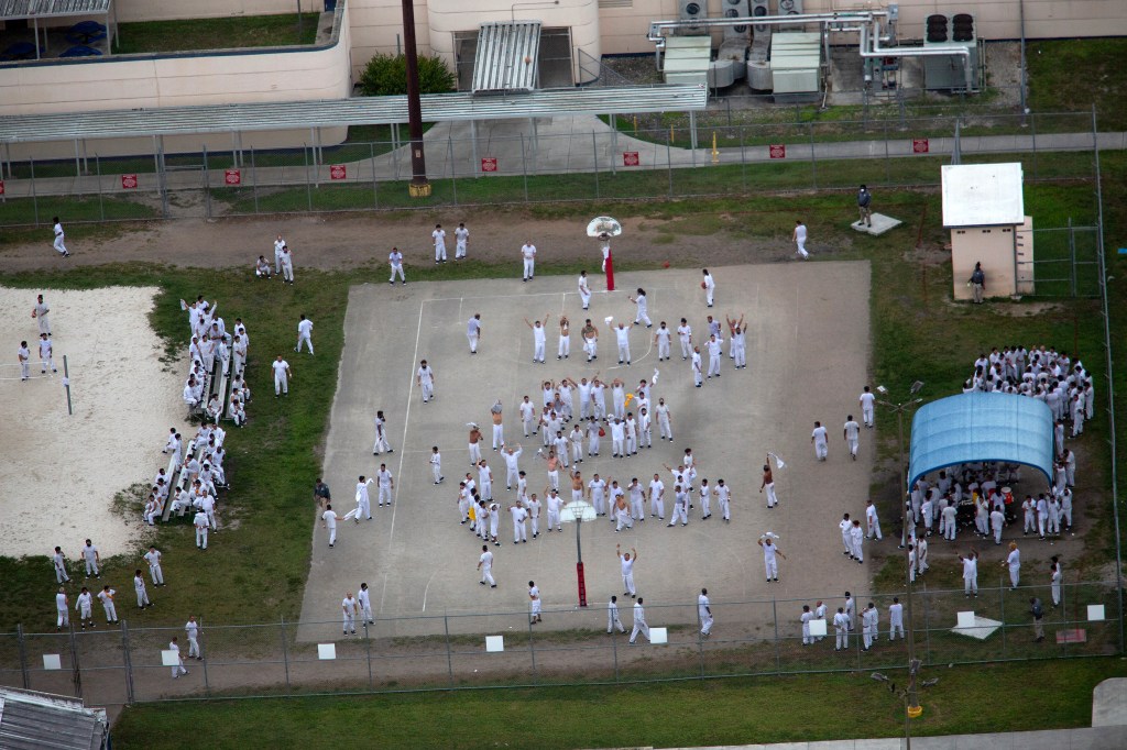 Aerial view of detainees in white uniforms at Krome Detention Center in Miami, Florida.