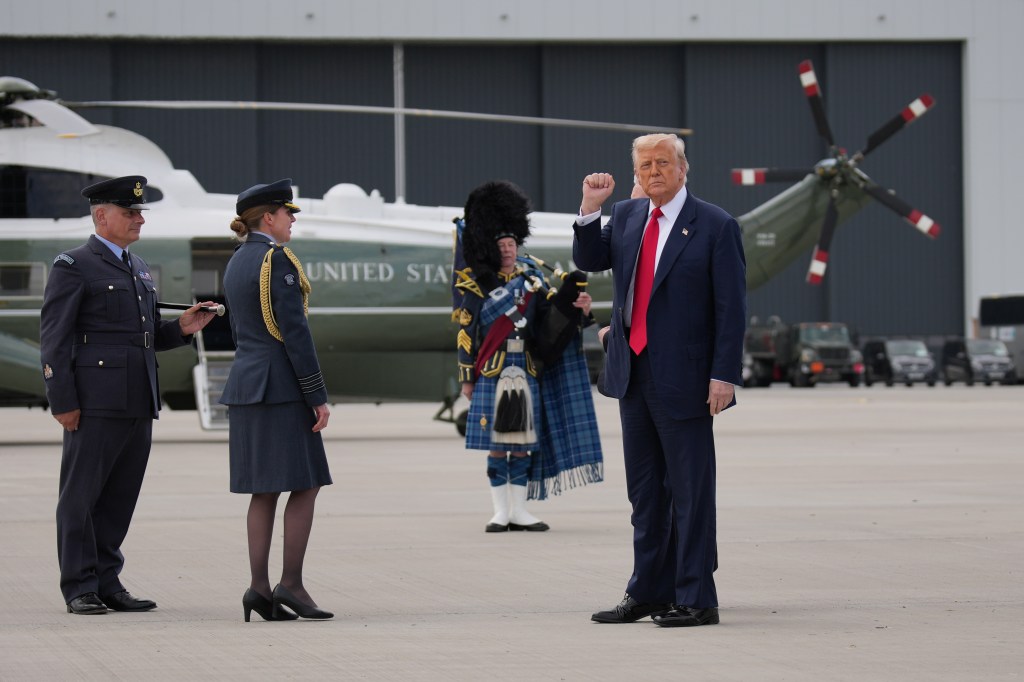 President Trump raising his fist while departing from RAF Lossiemouth.