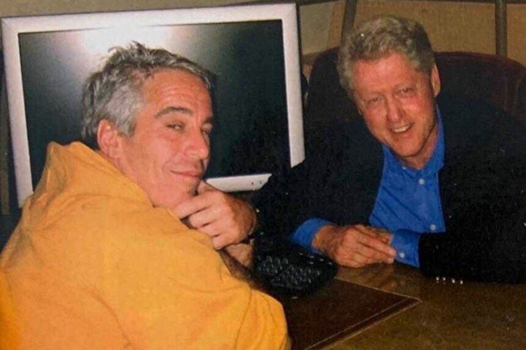 Jeffrey Epstein and Bill Clinton seated together.