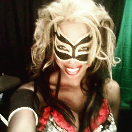 Woman wearing a wrestling mask.