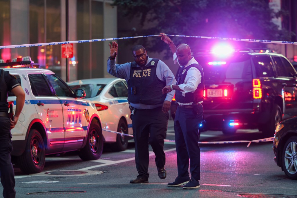 New York City police officers at a crime scene.