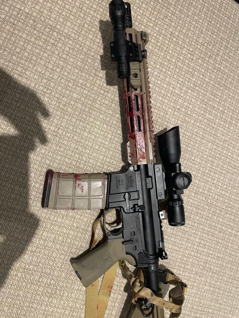 Blood-stained AR-15 rifle.