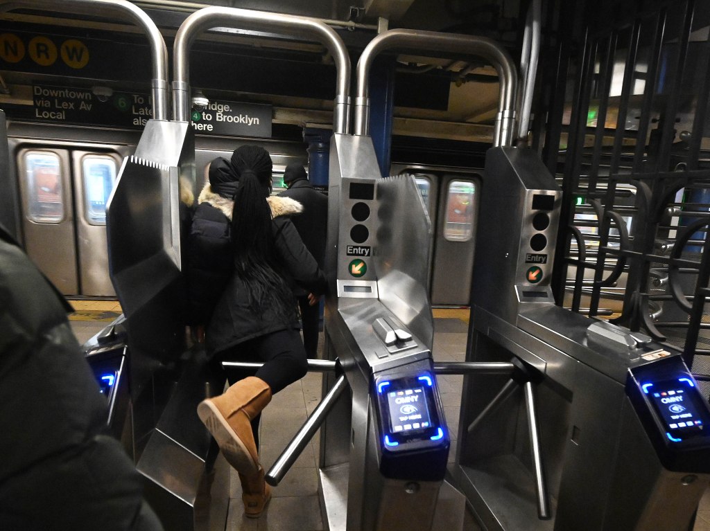 Subway turnstile jumpers at the 59th St./Lexington Ave. station.