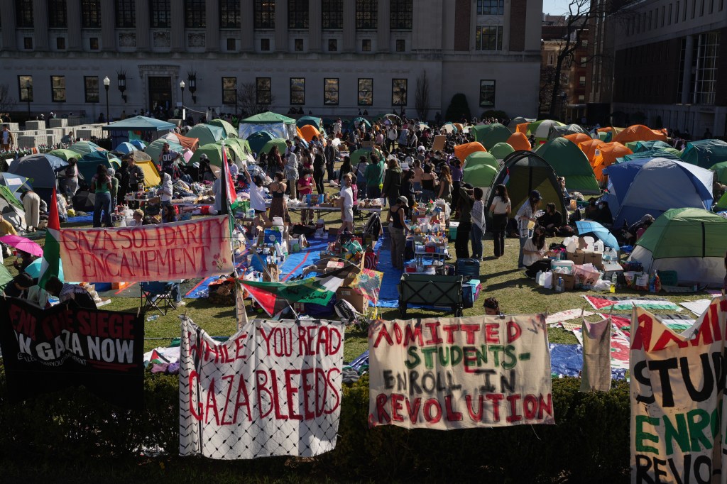 Pro-Palestinian rally at Columbia University with tents and signs.