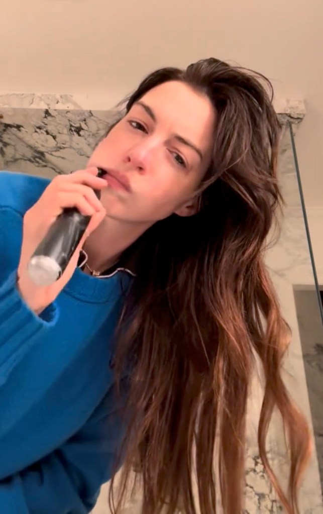 Anne Hathaway wearing a blue sweater in a TikTok