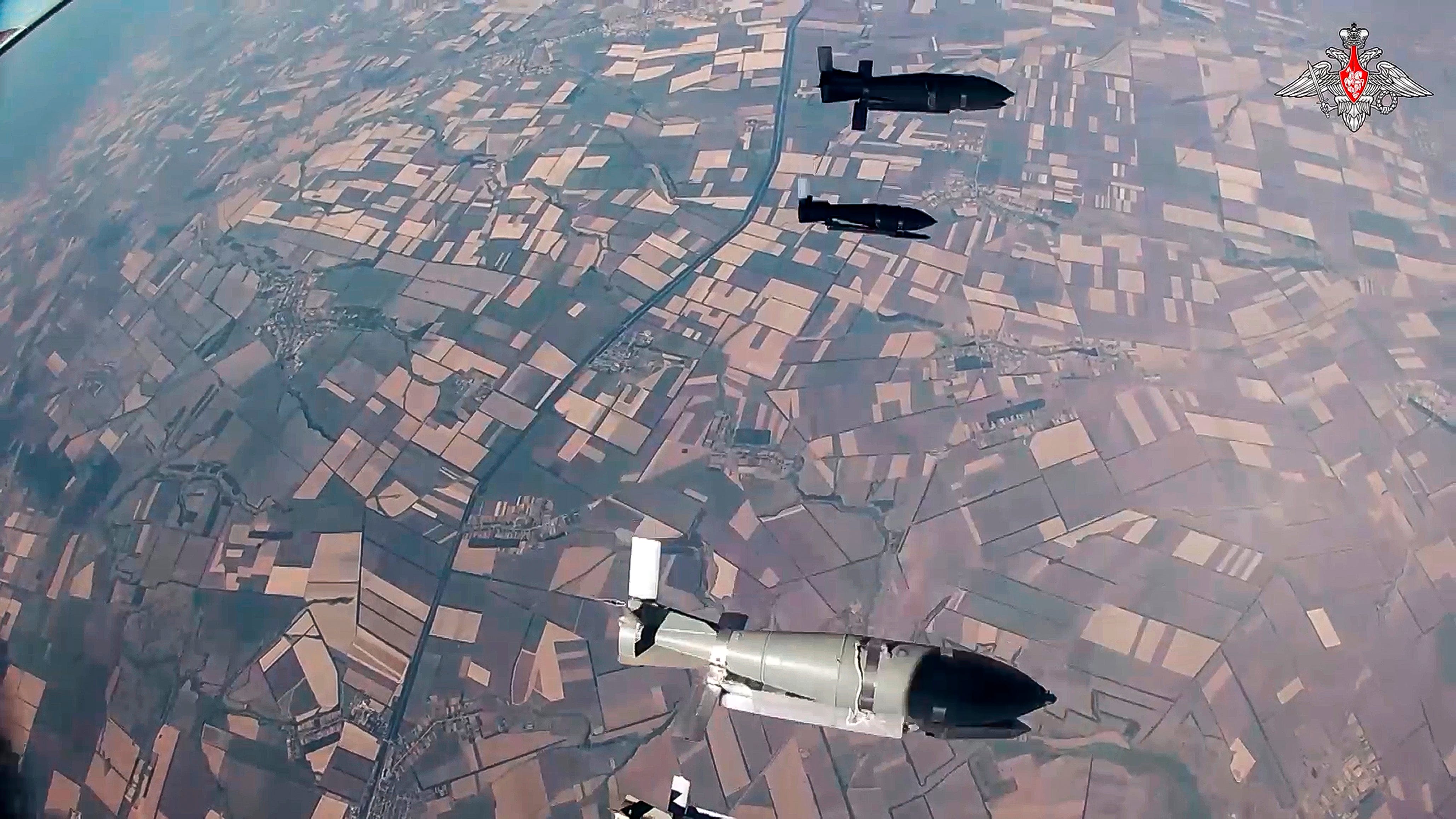 FILE - In this image made from a video released by the Russian Defense Ministry on Aug. 7, 2024, glide bombs are dropped by a Russian warplane to strike Ukrainian positions in an undisclosed location in Ukraine.