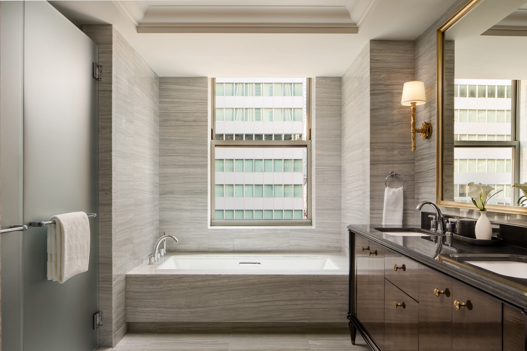 A bathroom in a hotel room at the Waldorf Astoria New York.