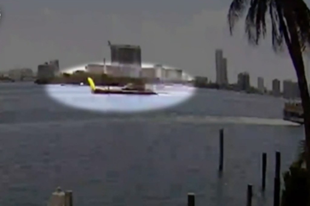 Video still of a barge hitting a sailboat.
