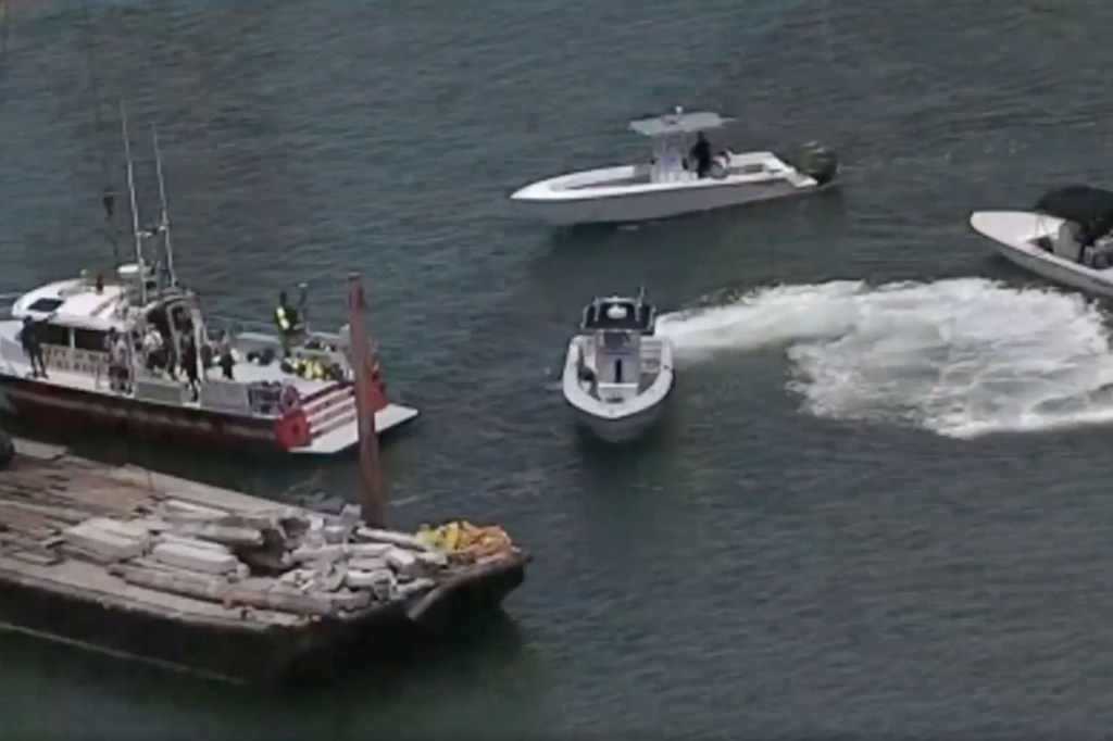 Aerial view of boats near a barge in Biscayne Bay.