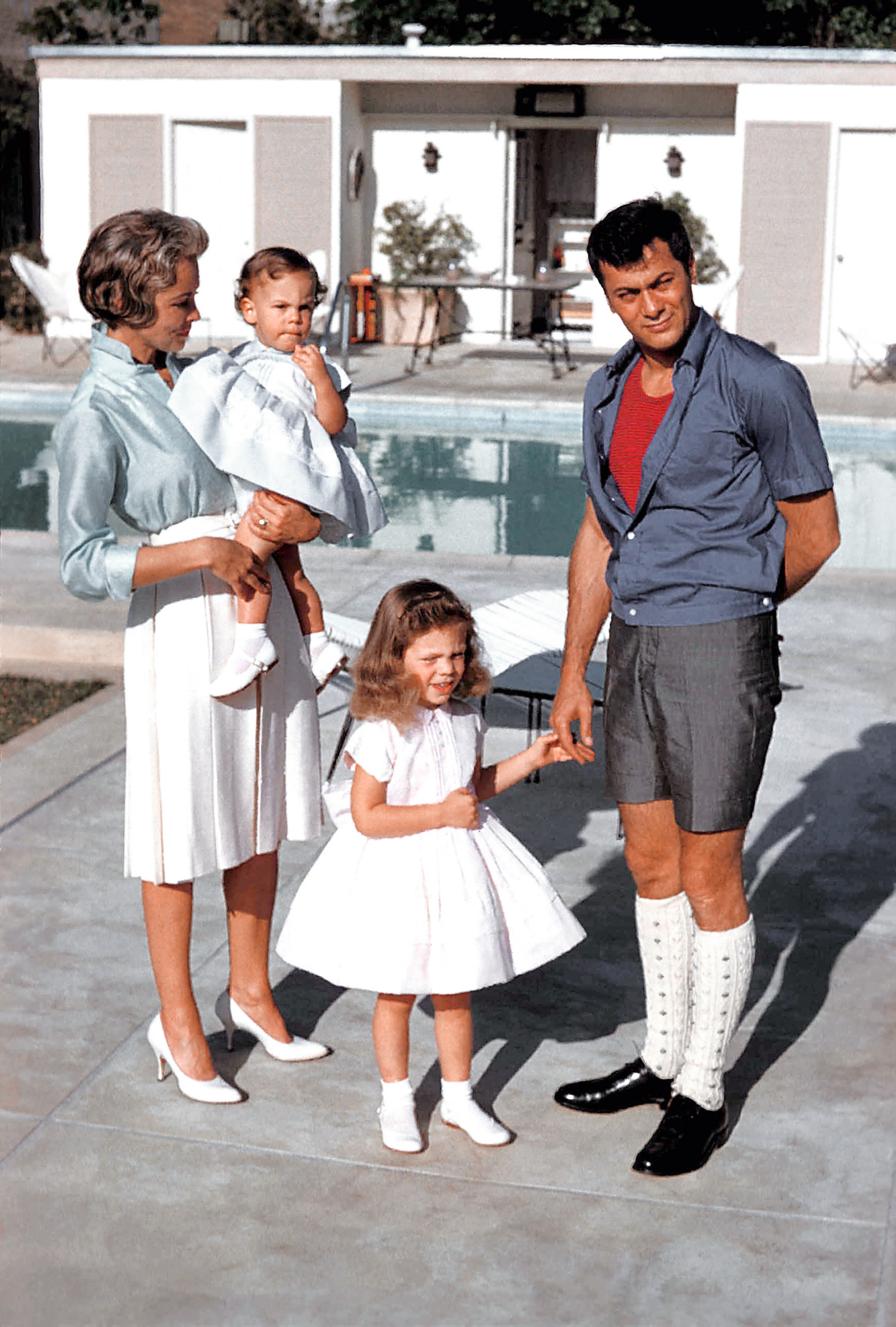 Janet Leigh and Tony Curtis play with their daughters daughters Jamie Lee Curtis and Kelly Curtis.