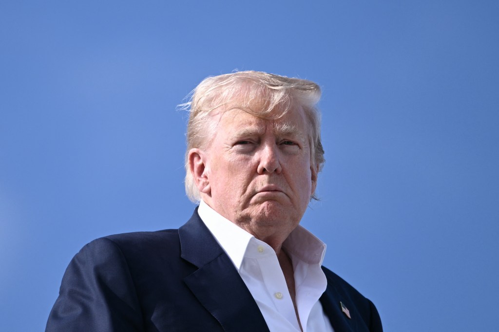 Close-up of Donald Trump against a blue sky.
