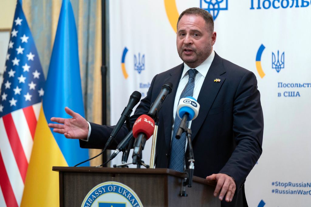 Andriy Yermak speaking at a podium.