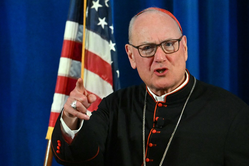 Cardinal Timothy Michael Dolan at a press conference.