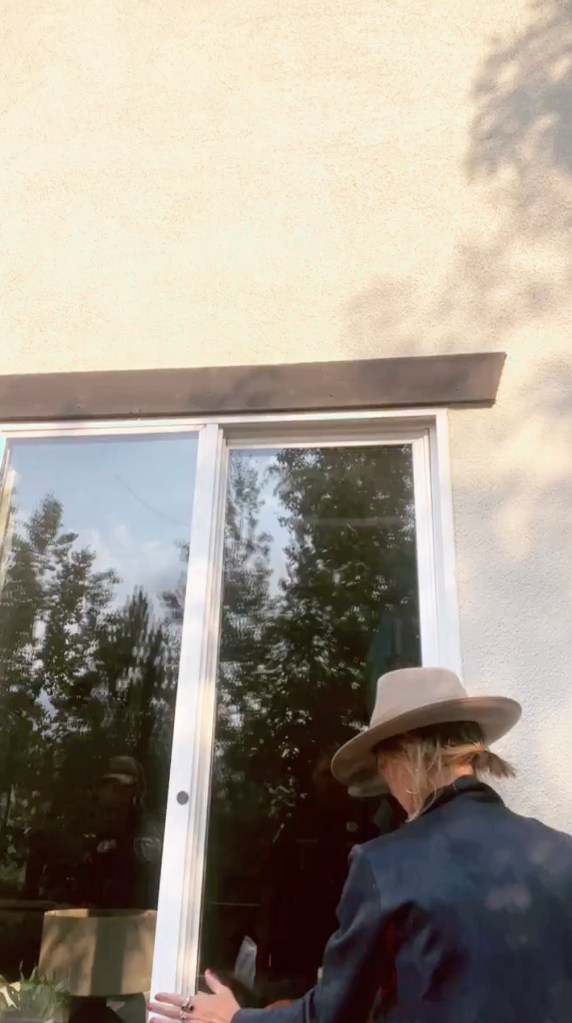 Kelley Wolf attempting to enter her home in Park City, Utah.