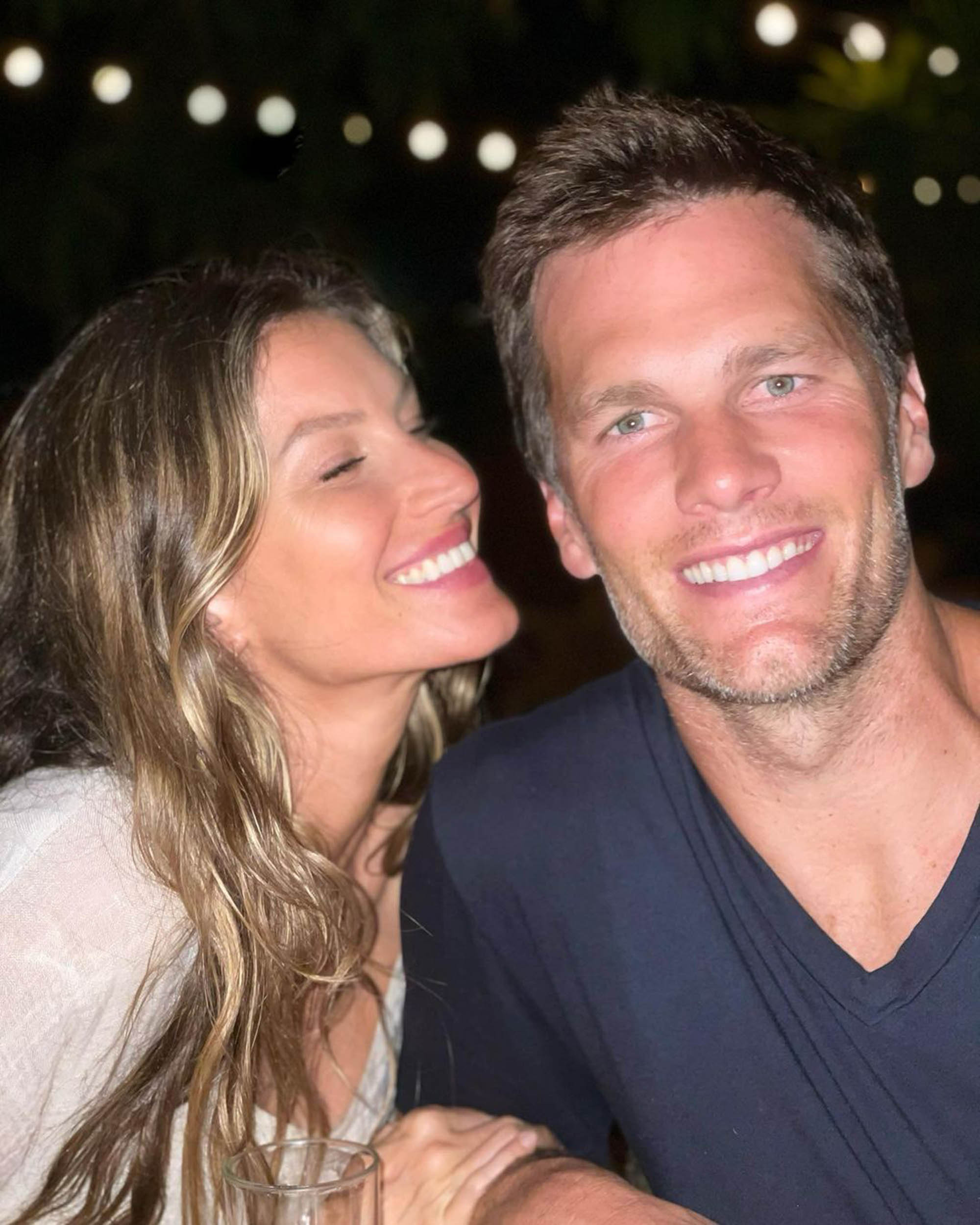 Gisele Bündchen smiles at Tom Brady. 