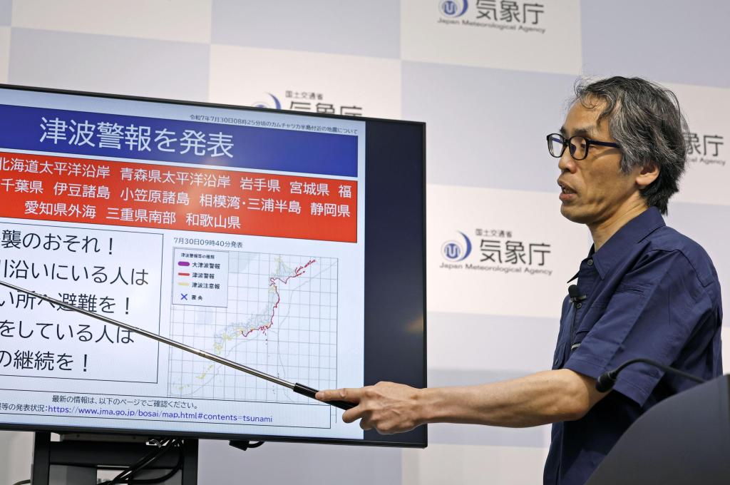 An official of the Japan Meteorological Agency speaks at a press conference in Tokyo on July 30, 2025, after the agency issued a tsunami warning for the country's Pacific coast following a powerful earthquake off Russia's Kamchatka Peninsula. 
