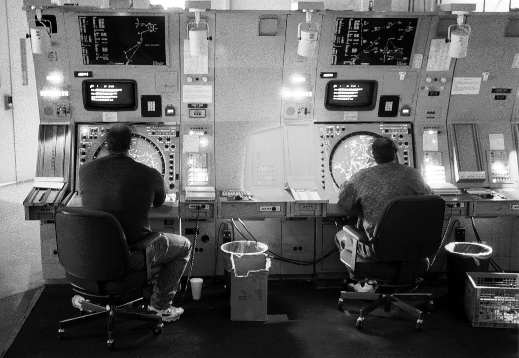 Air traffic controllers monitoring air traffic.