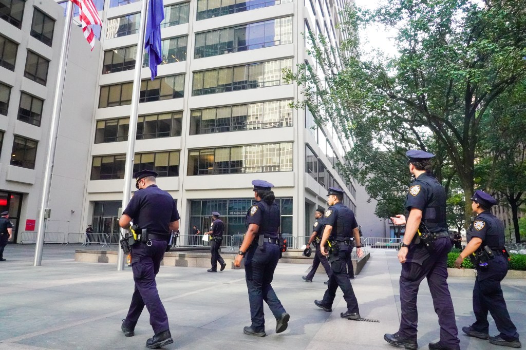 NYPD officers outside a building following a mass shooting.