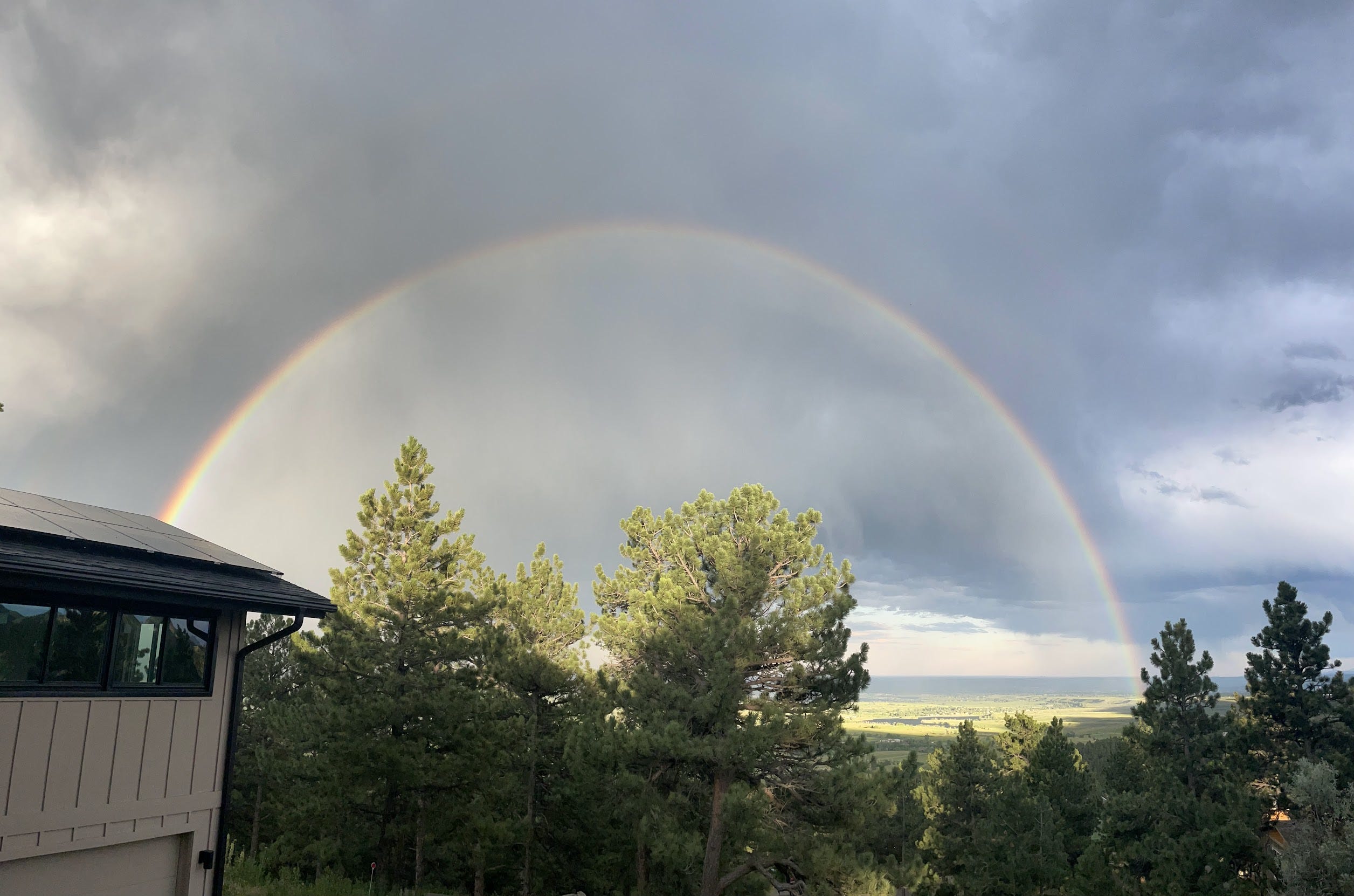 giant rainbow in colorado skies