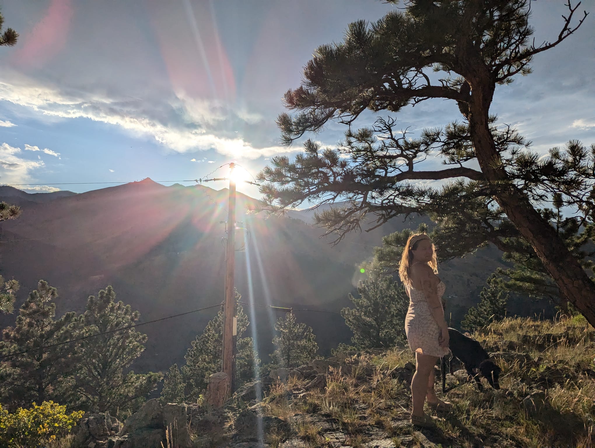 woman with dog in colorado wilderness