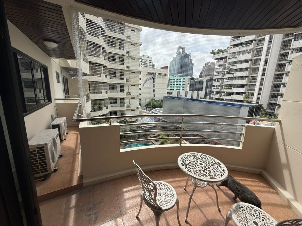 balcony off the living room overlooks the pool