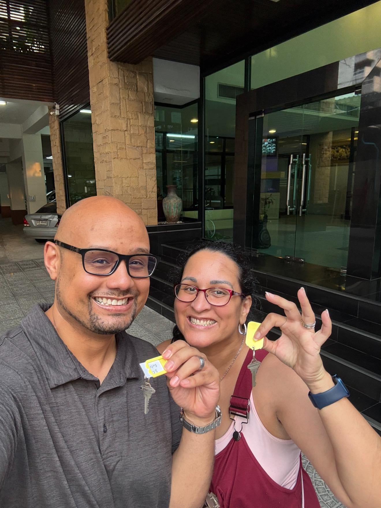 Kimanzi Constable and wife holding up apartment keys